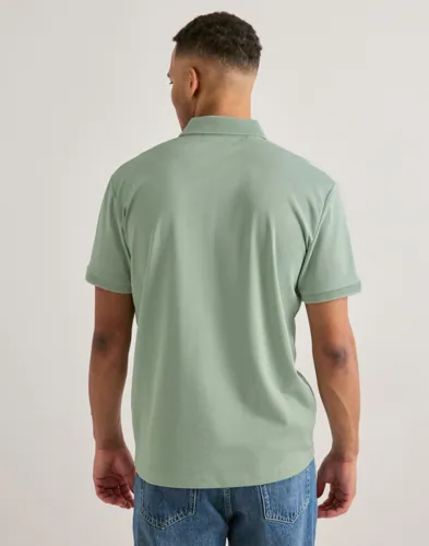 Selected Men Slhfave Zip Ss Polo Noos Kortermet poloskjorte Grønn Selected Men Slhfave Zip Ss Polo Noos Kortermet poloskjorte Grønn