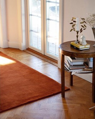 Kilands Skimmer terracotta – håndvevd ullteppe