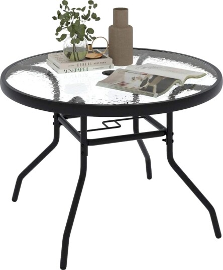 Rundt utebord med glassplate og hull for parasoll