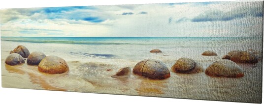 Lerretsbilde 80x30 cm Runde steiner på en strand med hav og himmel i bakgrunnen Blå / Beige / Grå