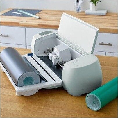 Cricut cutting machine roll feeder