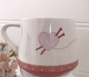 Krus med teksten "All you knit is Love"
